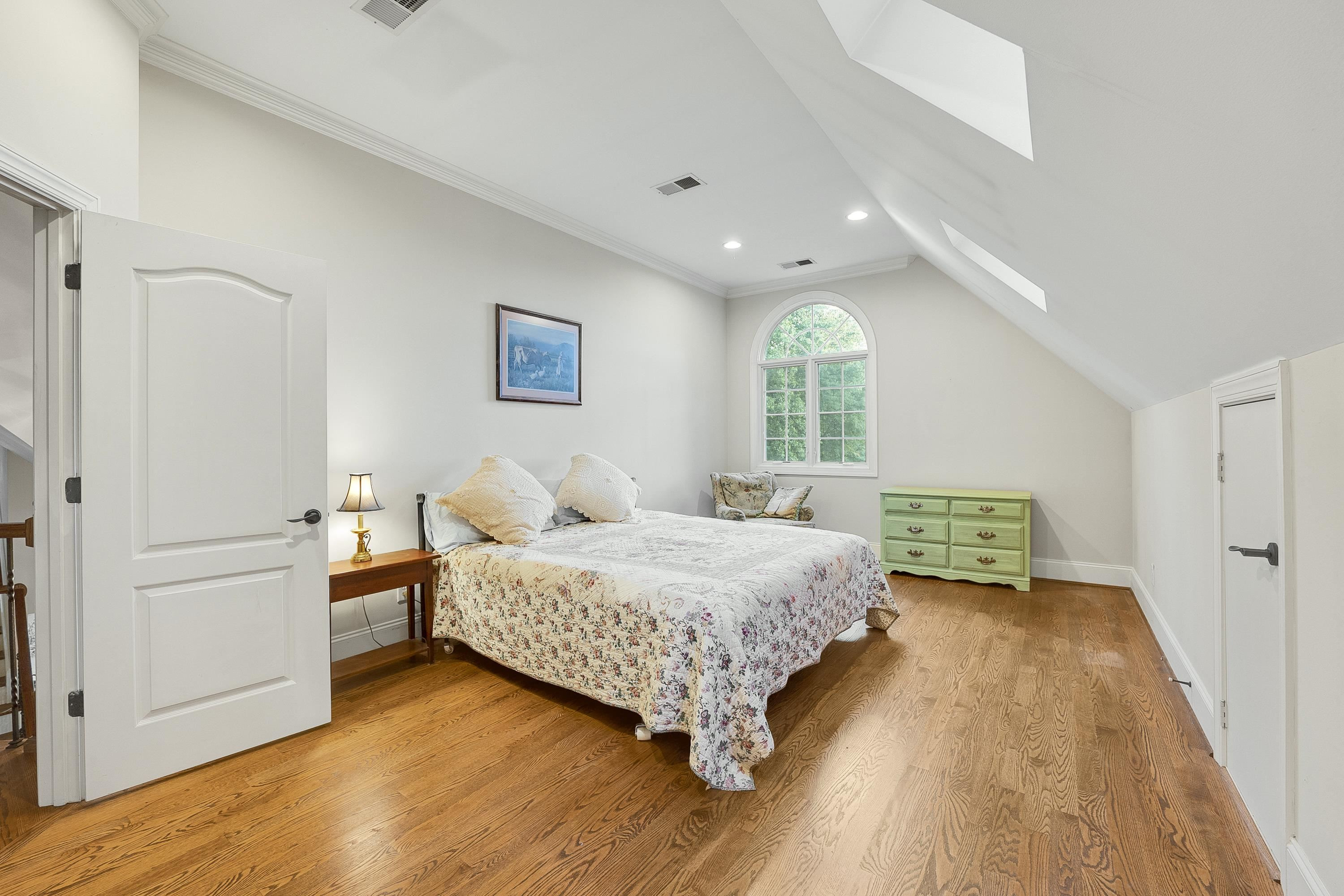 5401 Nicks Road Mebane, NC 27302 - Photo 25 of 53 a bedroom with a bed and a large window