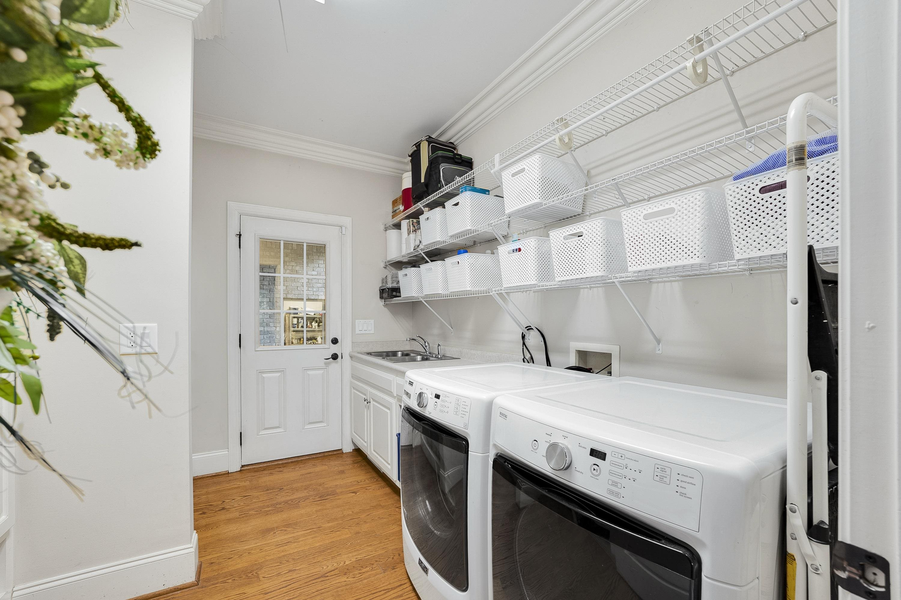 5401 Nicks Road Mebane, NC 27302 - Photo 28 of 53 a view of a kitchen with cabinets and wooden floor