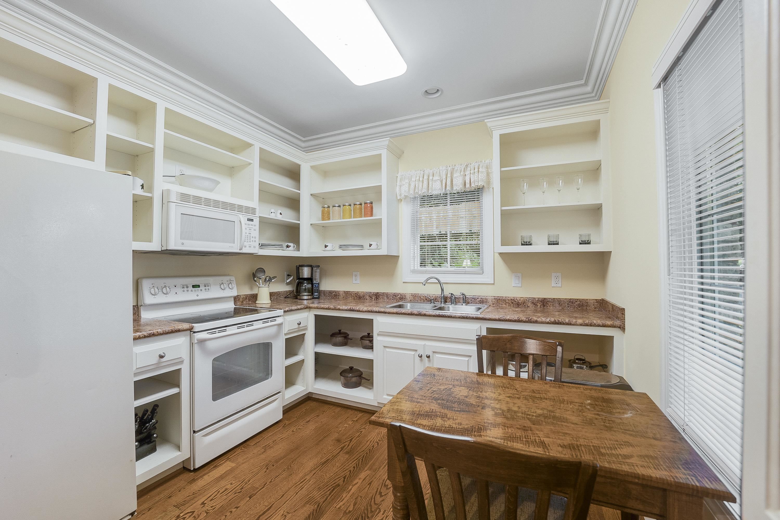 5401 Nicks Road Mebane, NC 27302 - Photo 32 of 53 a kitchen with stainless steel appliances granite countertop a stove and cabinets