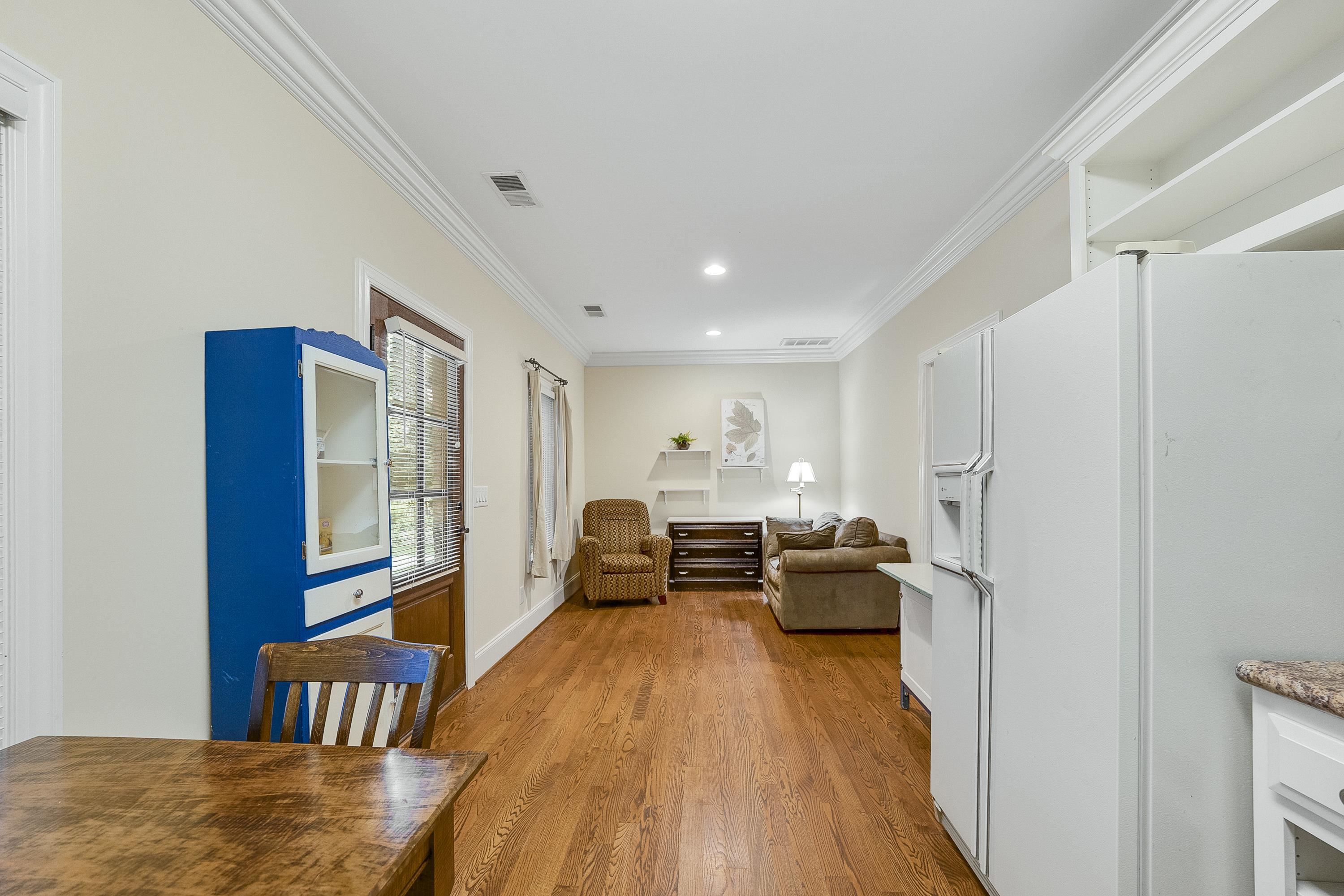 5401 Nicks Road Mebane, NC 27302 - Photo 33 of 53 a living room with furniture two large window and wooden floor