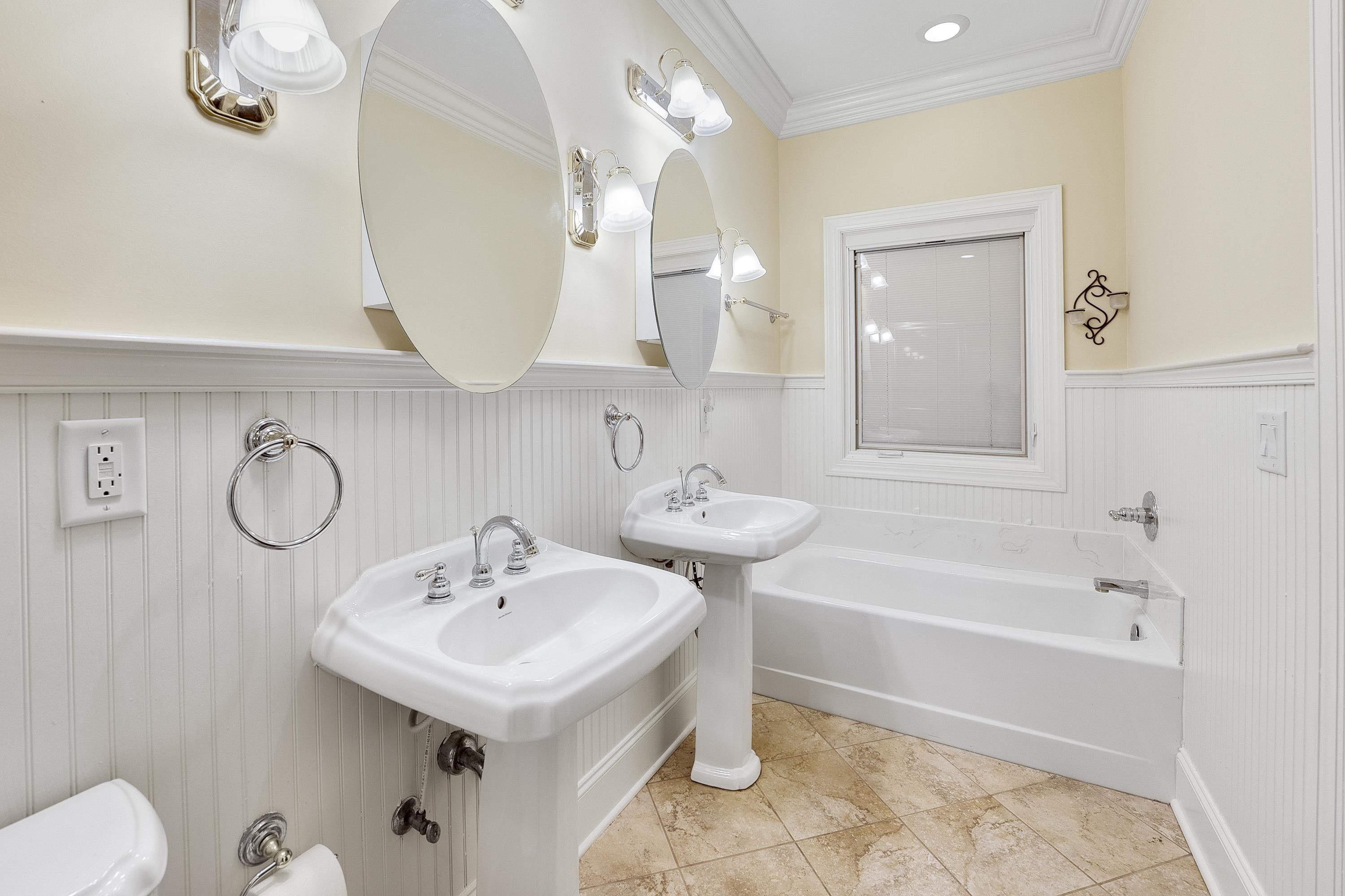 5401 Nicks Road Mebane, NC 27302 - Photo 36 of 53 a bathroom with a sink a toilet and bathtub