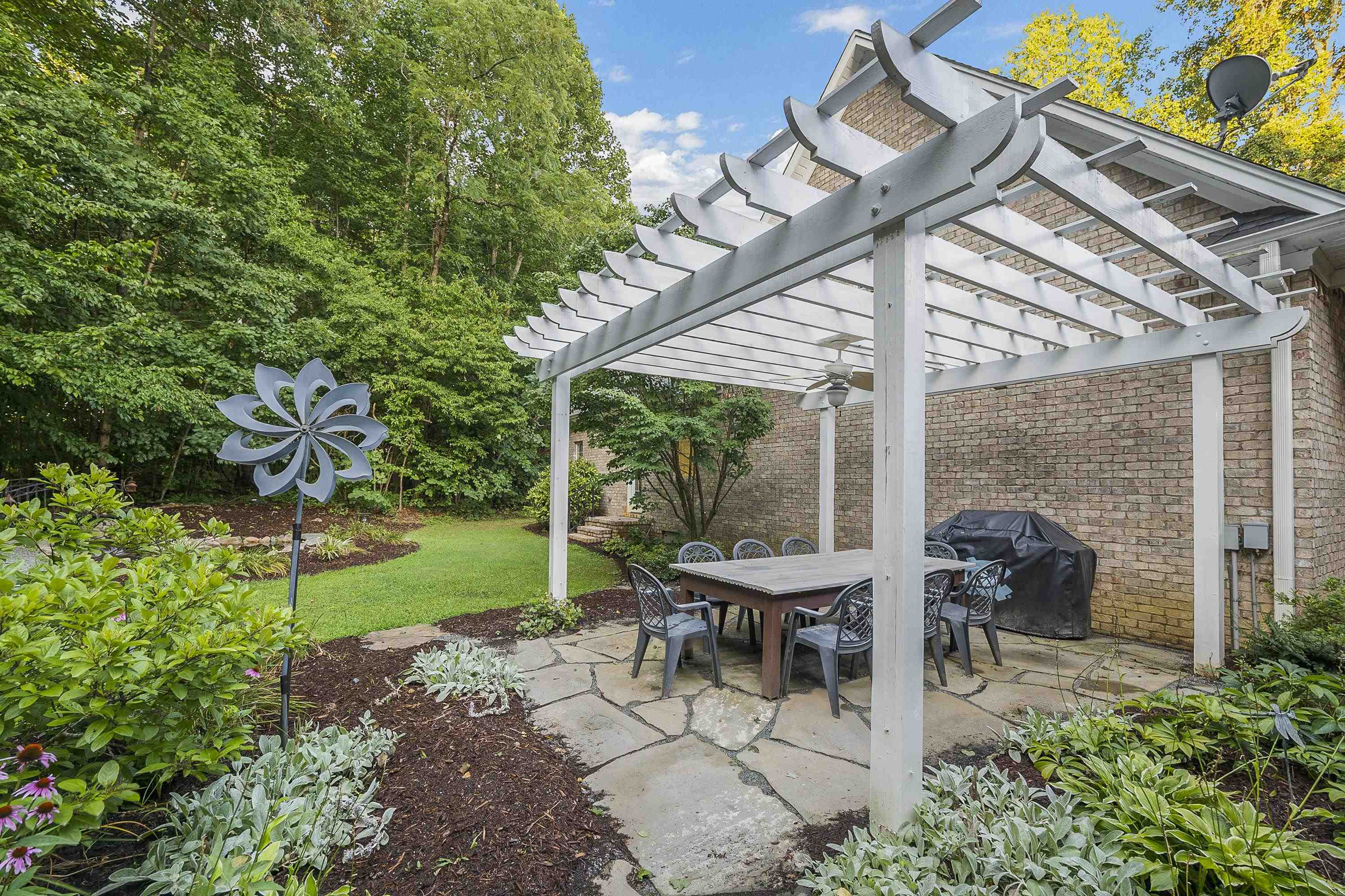 5401 Nicks Road Mebane, NC 27302 - Photo 39 of 53 a view of a patio with table and chairs and potted plants