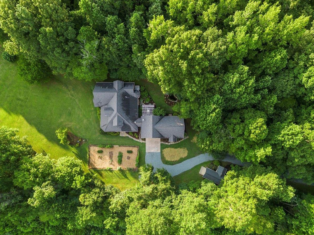 5401 Nicks Road Mebane, NC 27302 - Photo 50 of 53 an aerial view of a house with swimming pool a yard and a fountain