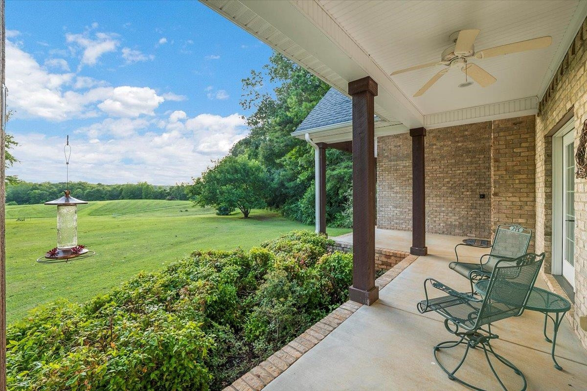 5401 Nicks Road Mebane, NC 27302 - Photo 5 of 53 a view of a patio with a table chairs and a yard