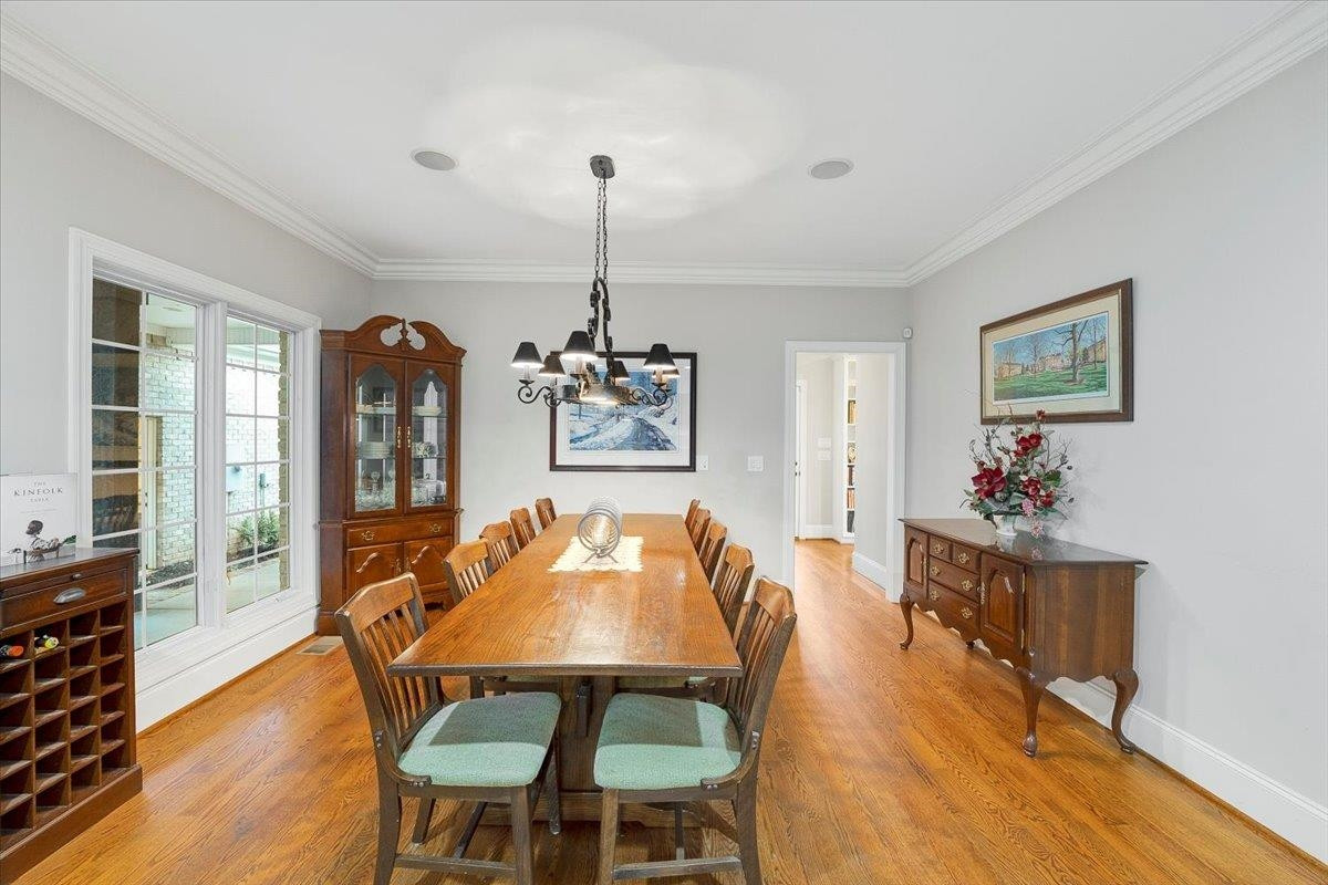 5401 Nicks Road Mebane, NC 27302 - Photo 10 of 53 a view of a dining room with furniture and wooden floor
