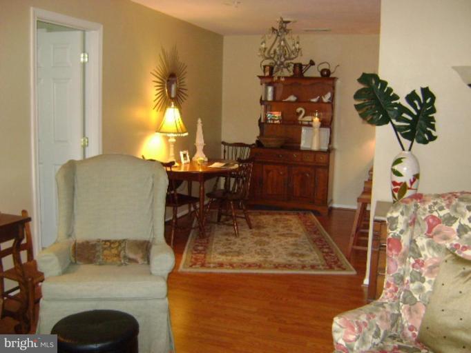 604 Churchill Road, Unit O Bel Air, MD 21014 - Photo 13 of 30 a dining room with furniture and a chandelier