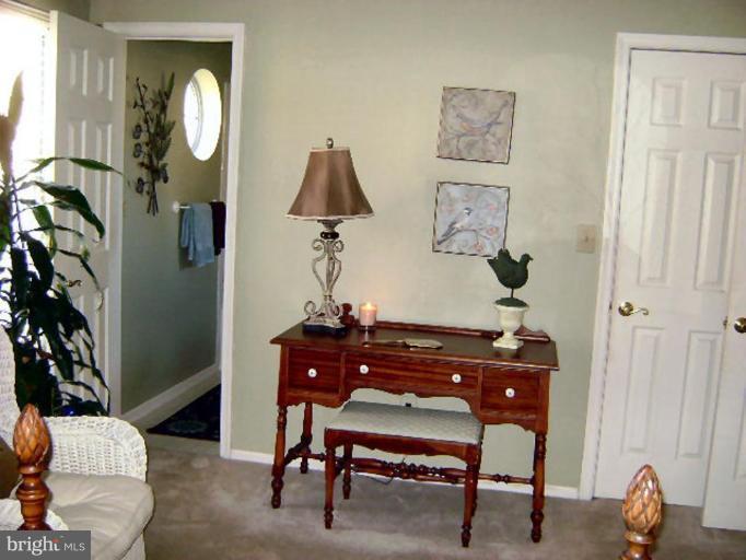 604 Churchill Road, Unit O Bel Air, MD 21014 - Photo 18 of 30 a room with furniture and a potted plant