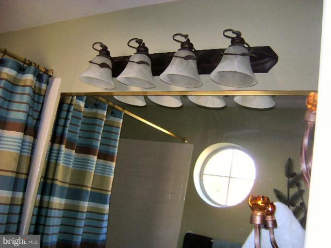 604 Churchill Road, Unit O Bel Air, MD 21014 - Photo 21 of 30 a bathroom with a sink and mirror