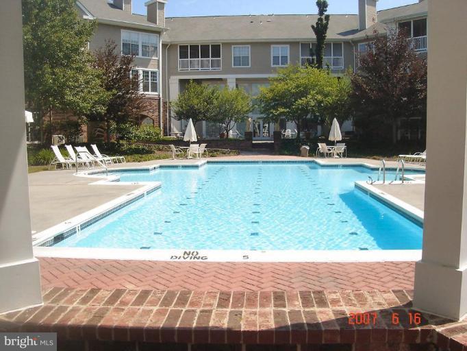 604 Churchill Road, Unit O Bel Air, MD 21014 - Photo 28 of 30 a view of a brick house with a small yard
