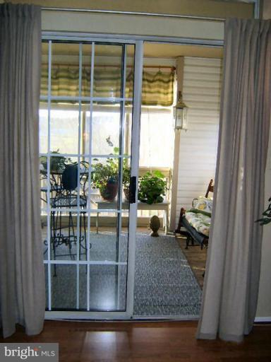 604 Churchill Road, Unit O Bel Air, MD 21014 - Photo 4 of 30 a view of a room with a floor to ceiling window and wooden floor