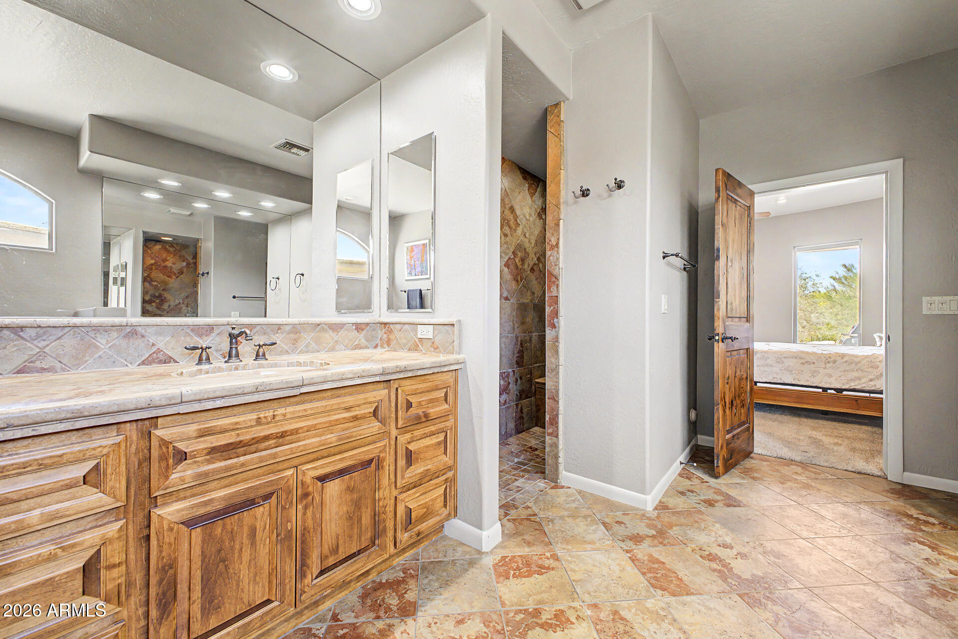 27909 North Quail Spring Road Rio Verde, AZ 85263 - Photo 21 of 52 a bathroom with a sink a vanity and a mirror