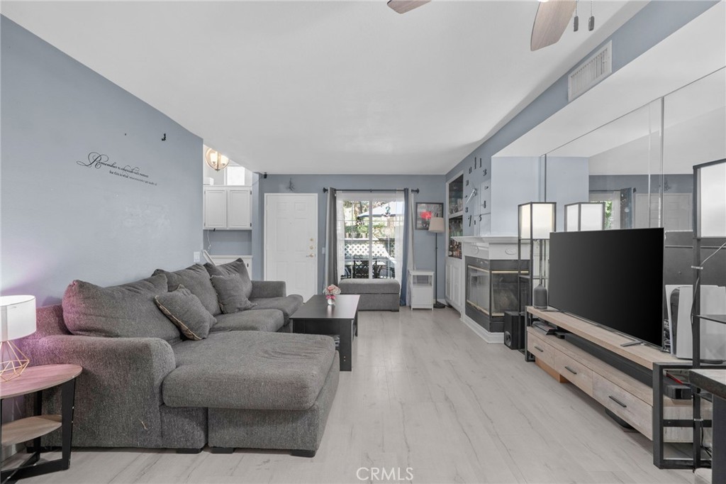 8264 Mondavi Place Rancho Cucamonga, CA 91730 - Photo 11 of 34 a living room with furniture and a flat screen tv