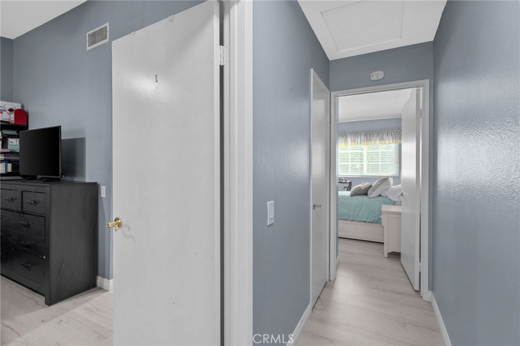 8264 Mondavi Place Rancho Cucamonga, CA 91730 - Photo 17 of 34 a view of a hallway and a livingroom with a bathroom