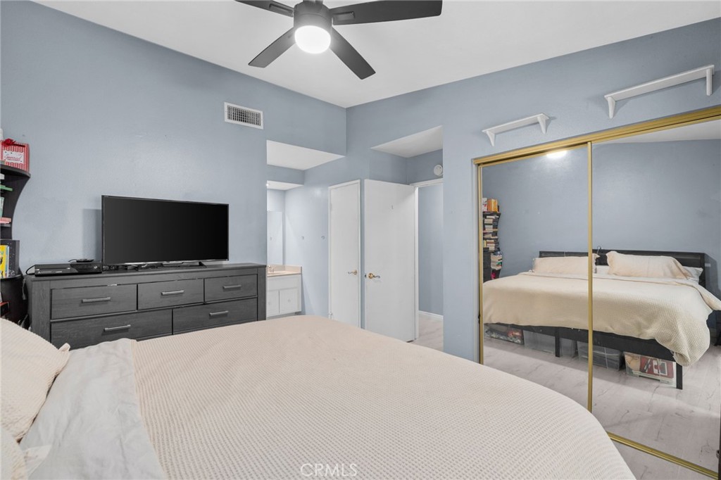 8264 Mondavi Place Rancho Cucamonga, CA 91730 - Photo 20 of 34 a bedroom with a bed and a flat screen tv