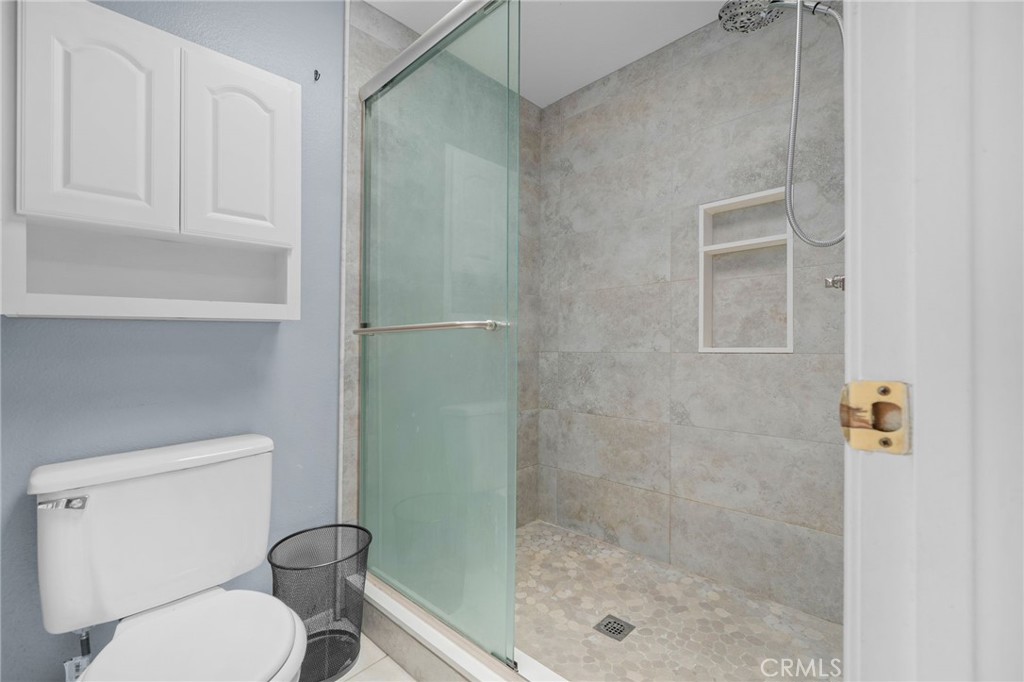 8264 Mondavi Place Rancho Cucamonga, CA 91730 - Photo 25 of 34 a white toilet sitting next to a shower
