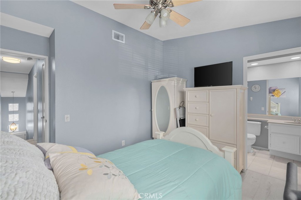 8264 Mondavi Place Rancho Cucamonga, CA 91730 - Photo 28 of 34 a bedroom with a bed and a television