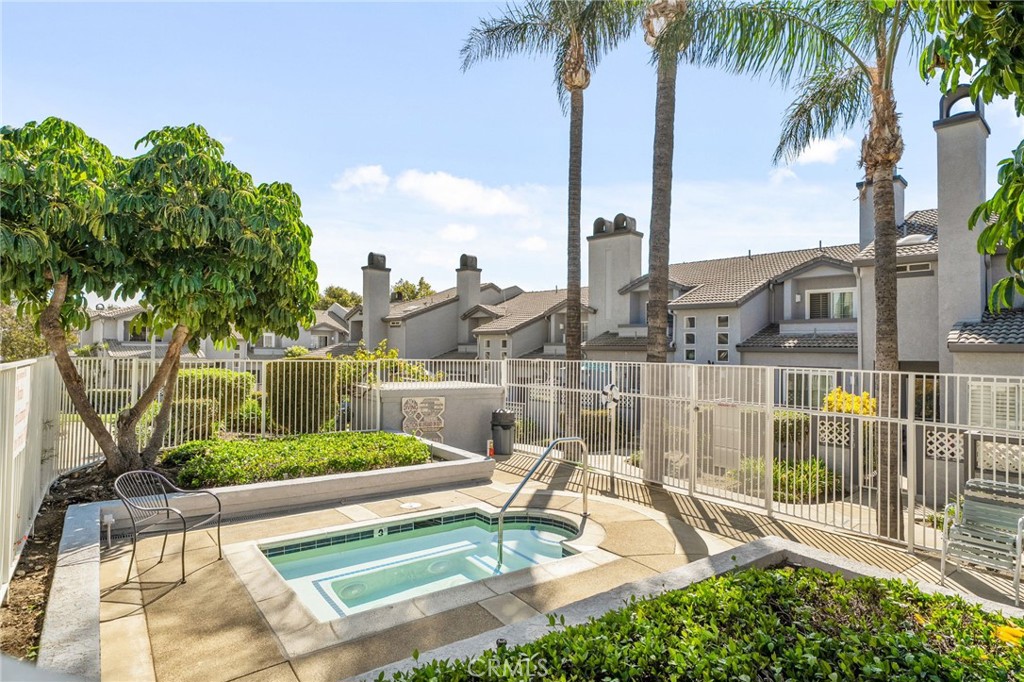 8264 Mondavi Place Rancho Cucamonga, CA 91730 - Photo 32 of 34 a view of a lake with a palm and table and chairs