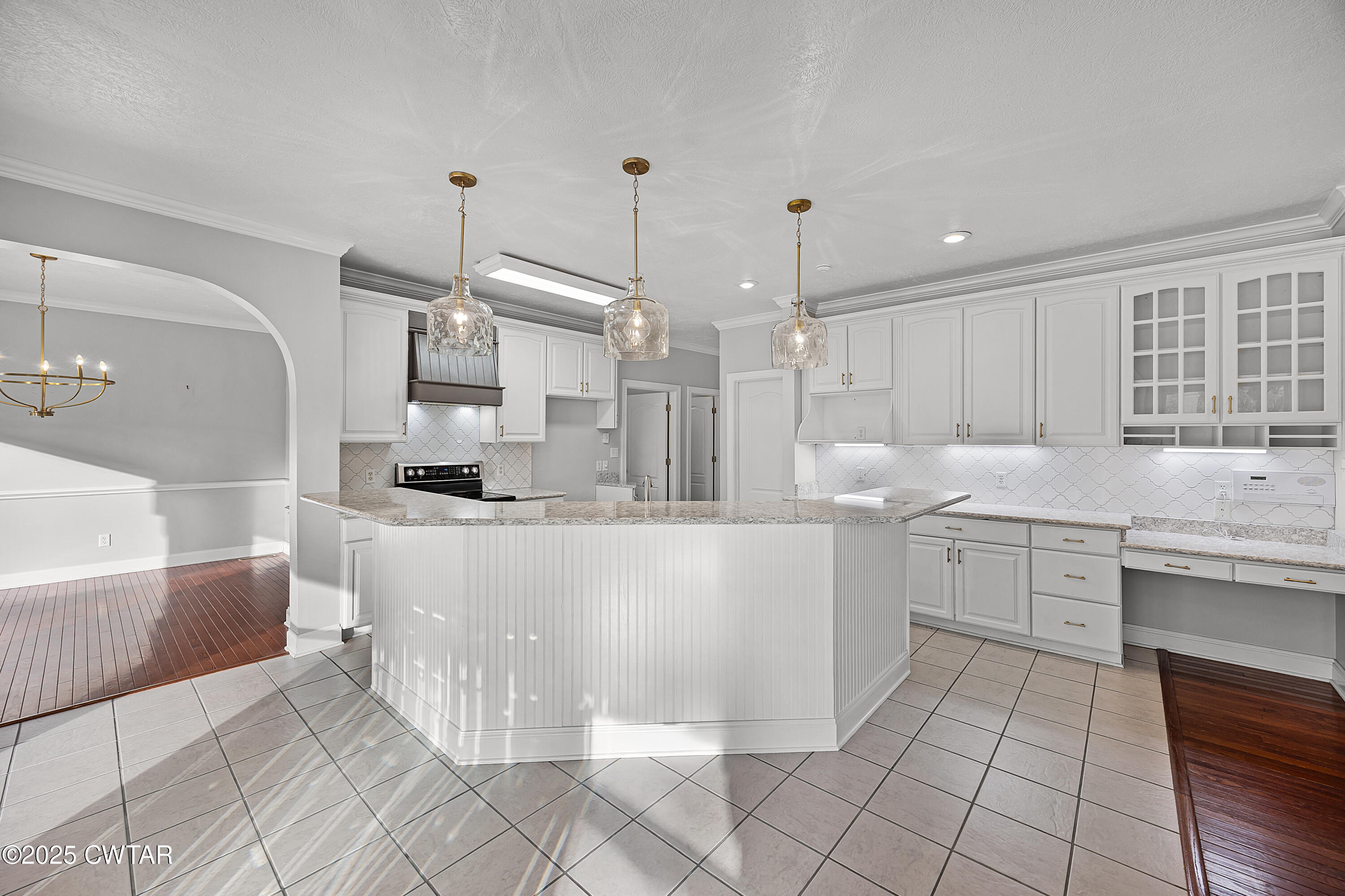 433 Sanders Bluff Road Three Way, TN 38343 - Photo 14 of 43 a kitchen with stainless steel appliances kitchen island granite countertop a sink and cabinets