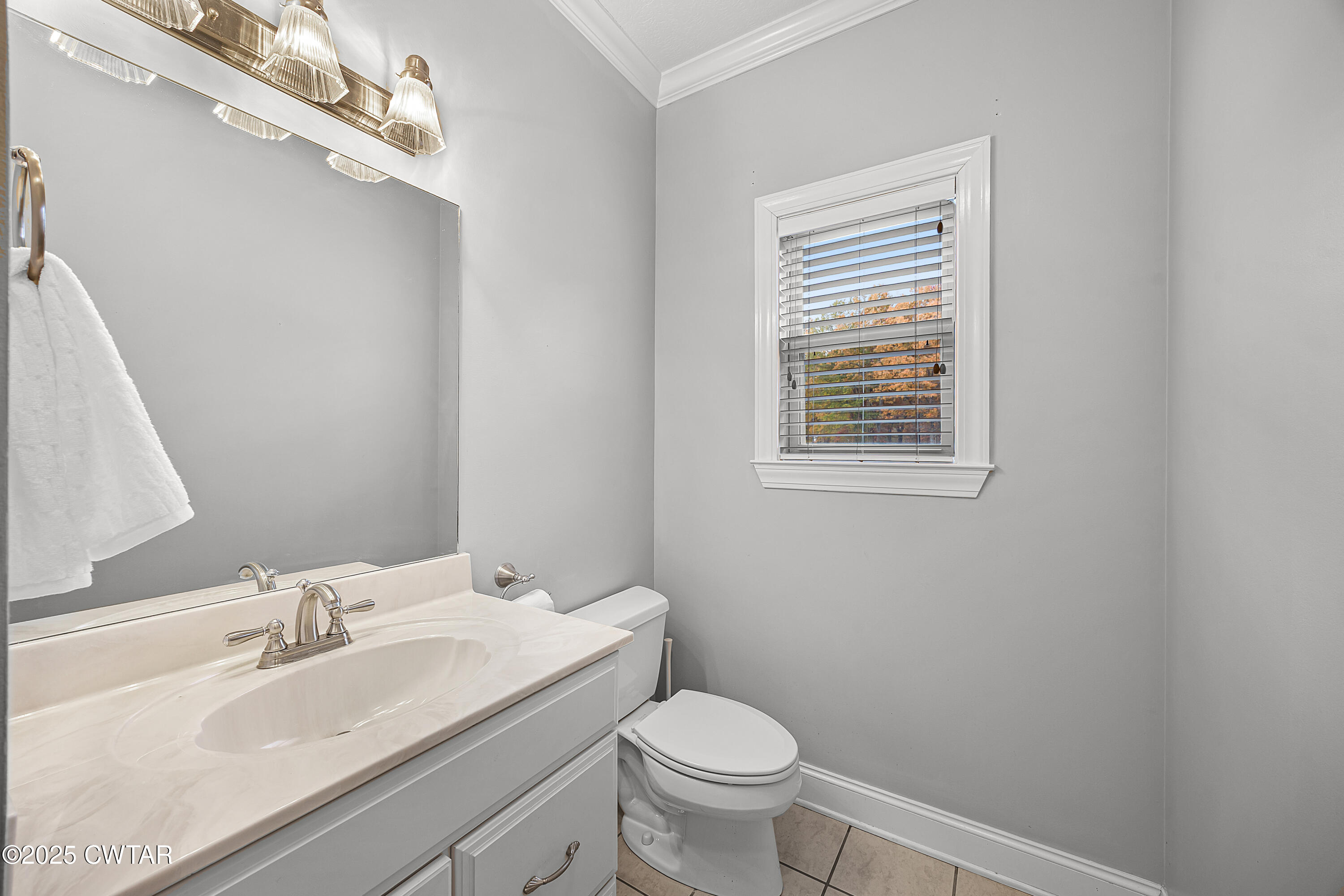 433 Sanders Bluff Road Three Way, TN 38343 - Photo 23 of 43 a bathroom with a sink a toilet and a mirror