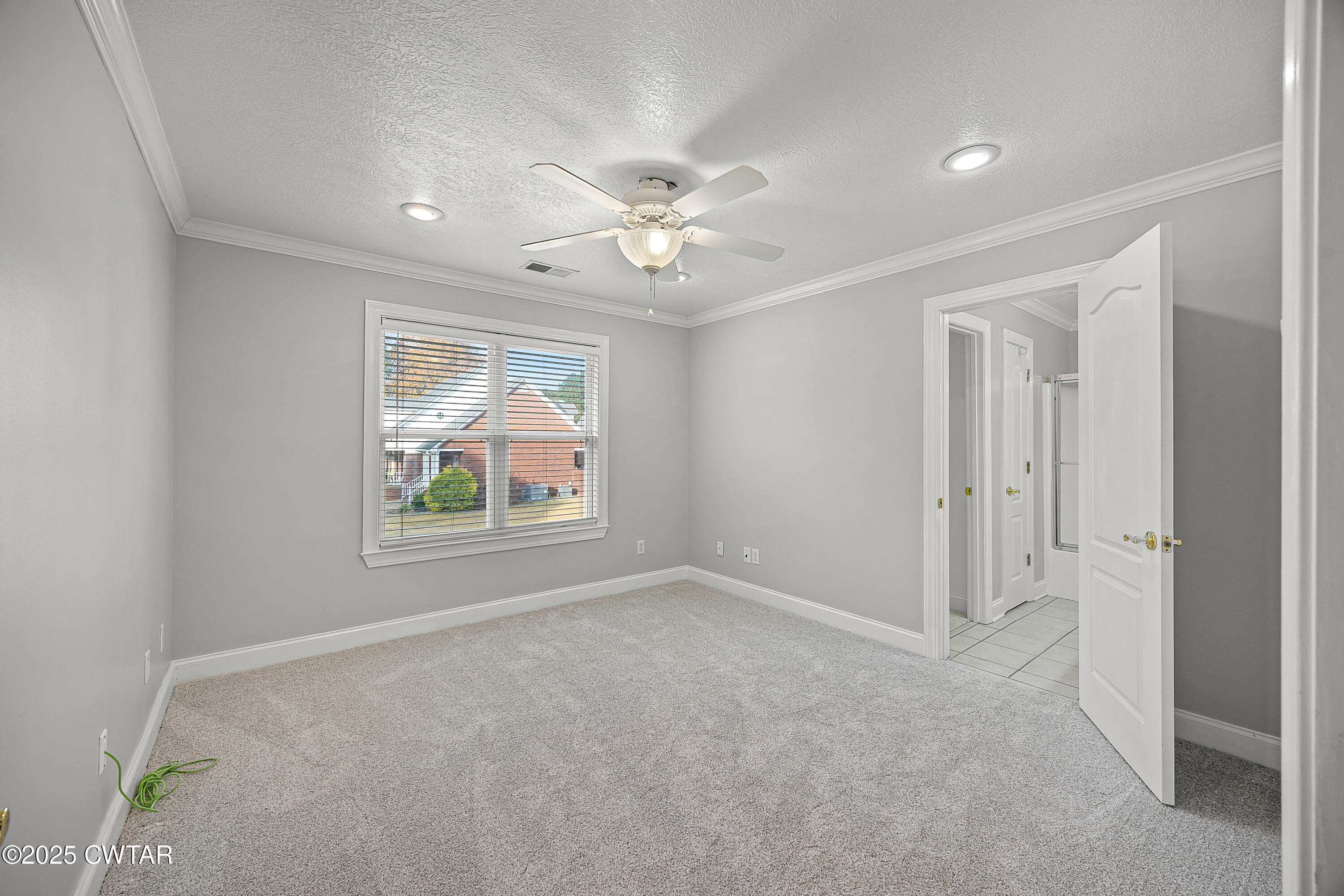 433 Sanders Bluff Road Three Way, TN 38343 - Photo 31 of 43 an empty room with windows and fan