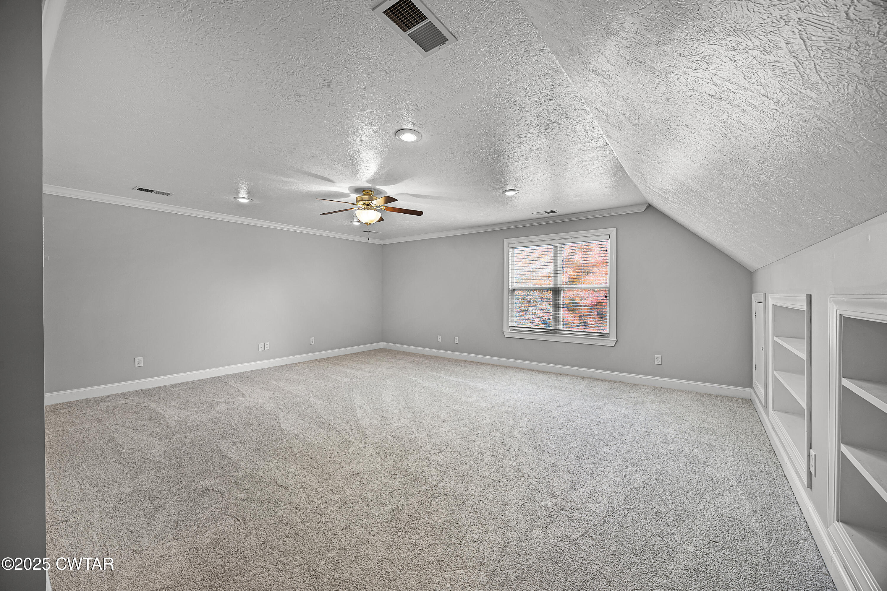433 Sanders Bluff Road Three Way, TN 38343 - Photo 33 of 43 an empty room with a ceiling fan and window
