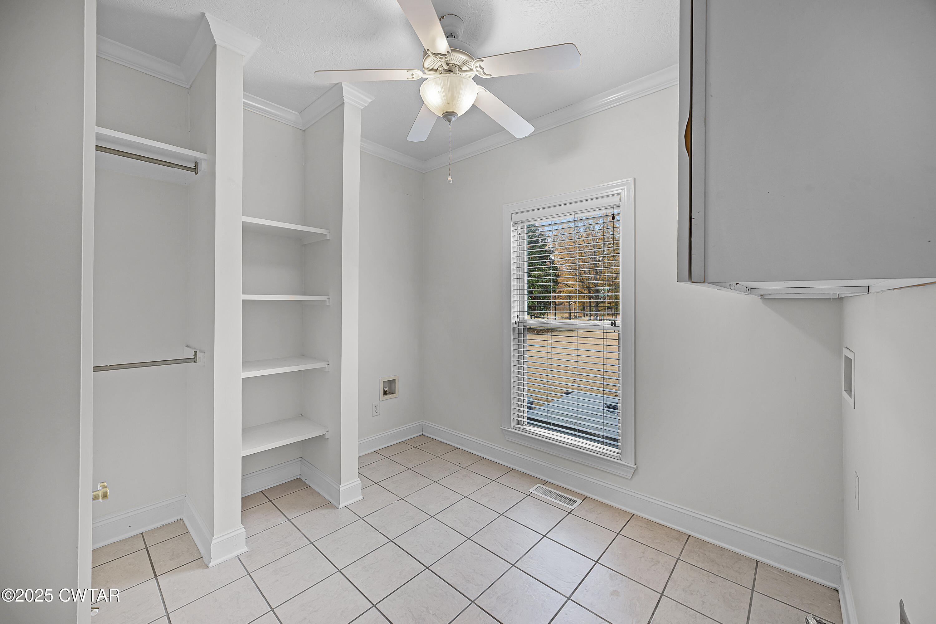 433 Sanders Bluff Road Three Way, TN 38343 - Photo 35 of 43 a view of an empty room with cabinet and a window