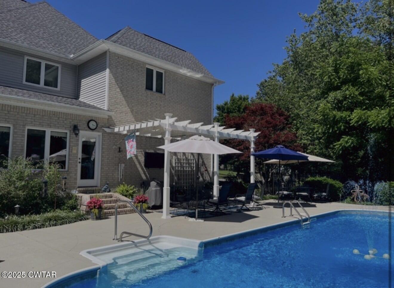 433 Sanders Bluff Road Three Way, TN 38343 - Photo 7 of 43 a front view of house with yard barbeque oven and outdoor seating