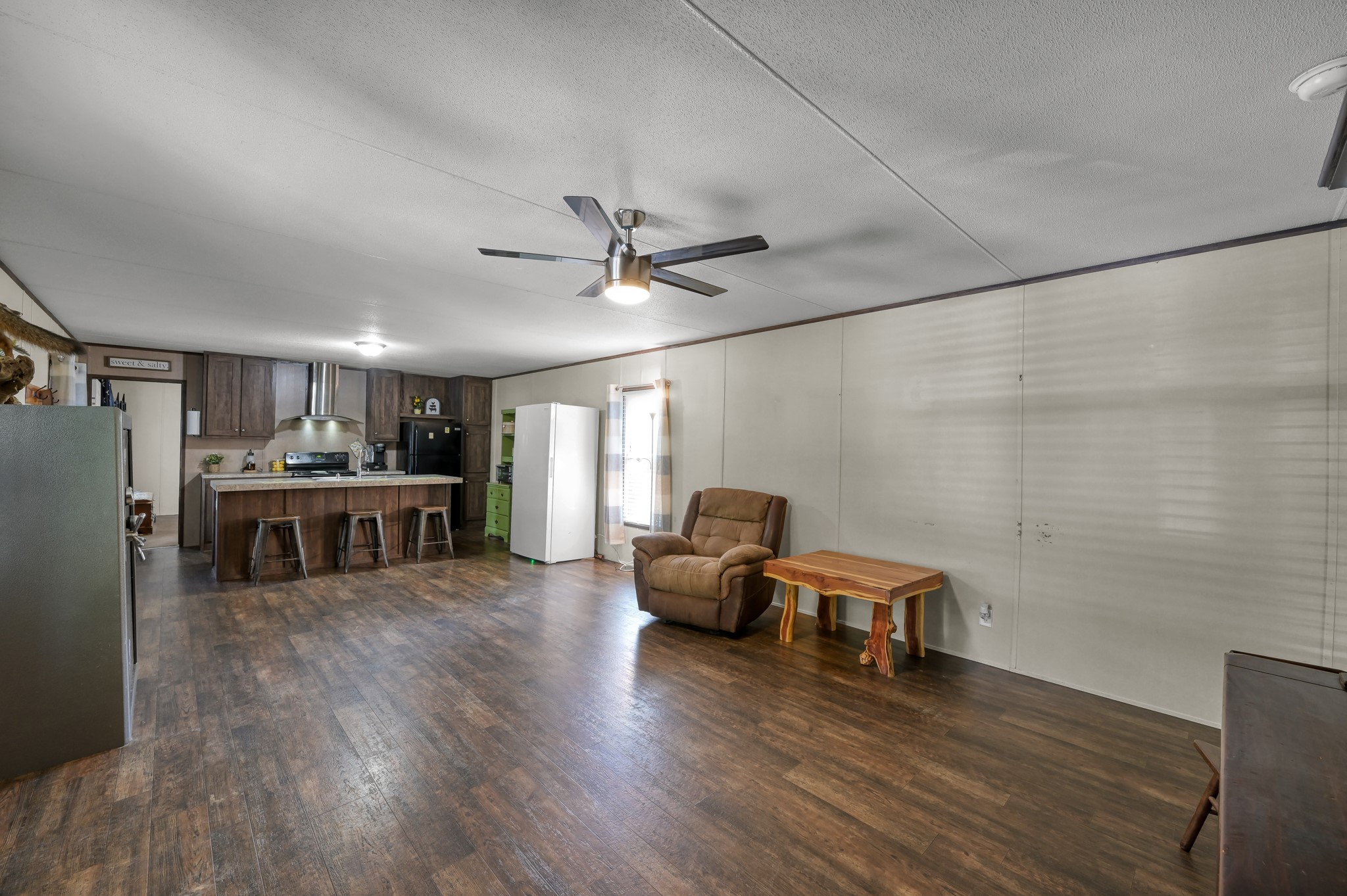 400 Raven Hill Road Oakhurst, TX 77359 - Photo 20 of 45 a living room with furniture and wooden floor