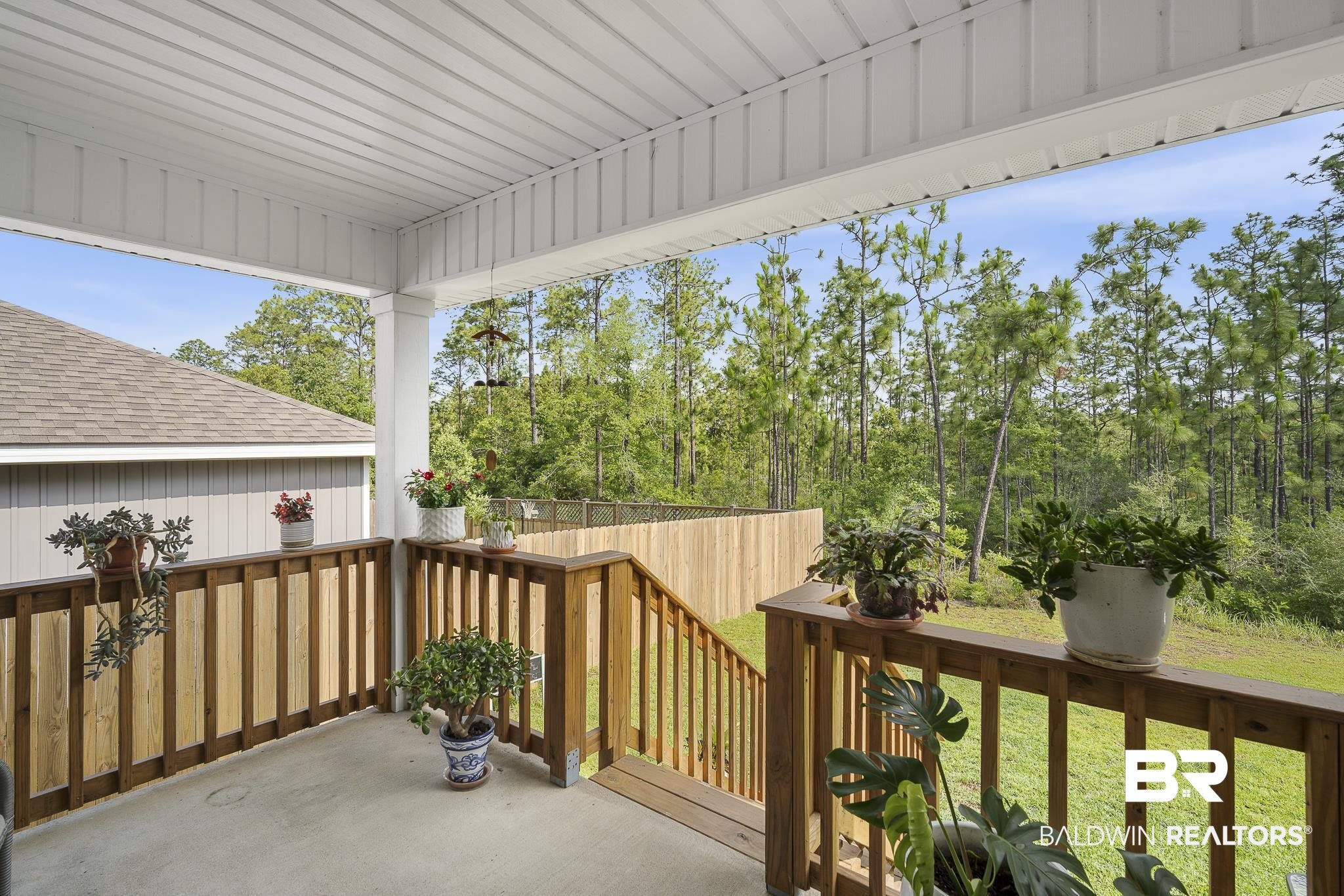 10232 Brodick Loop Spanish Fort, AL 36527 - Photo 23 of 29 View of patio featuring a wooden deck and view of wooded area