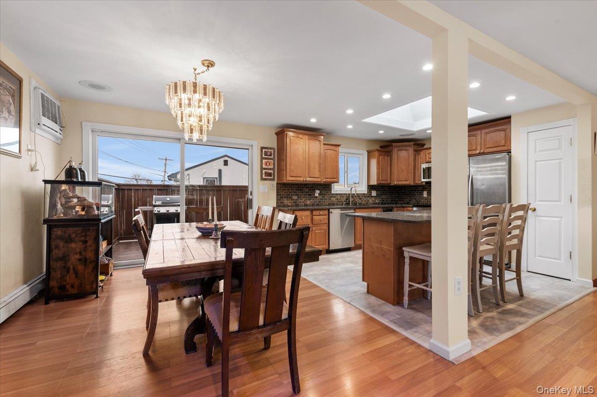 2747 Barbara Road Bellmore, NY 11710 - Photo 11 of 30 Dining Room W/ Sliders Leading Out To Deck.