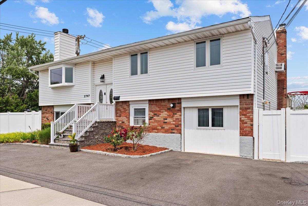 2747 Barbara Road Bellmore, NY 11710 - Photo 3 of 30 Front Of The House From The Side