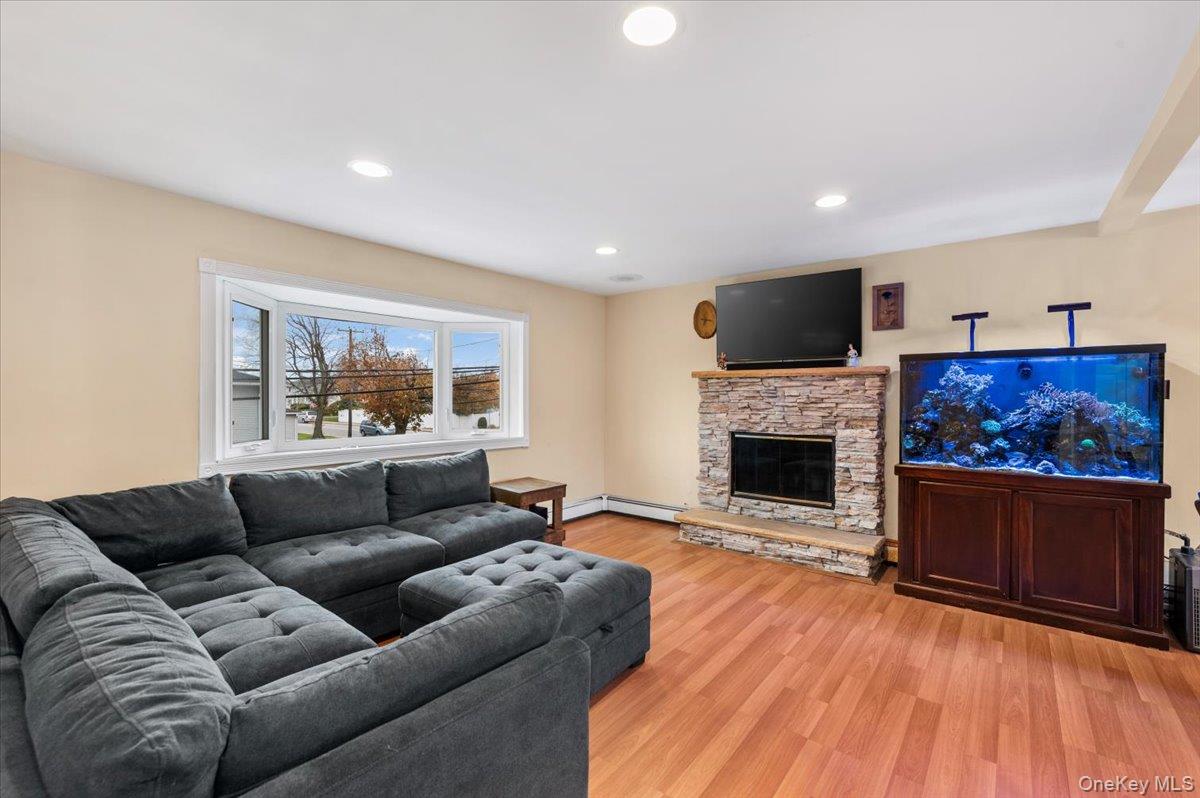 2747 Barbara Road Bellmore, NY 11710 - Photo 4 of 30 Living Room With Bay Window & Wood Burning Fire Place, View From Top Of The Stairs