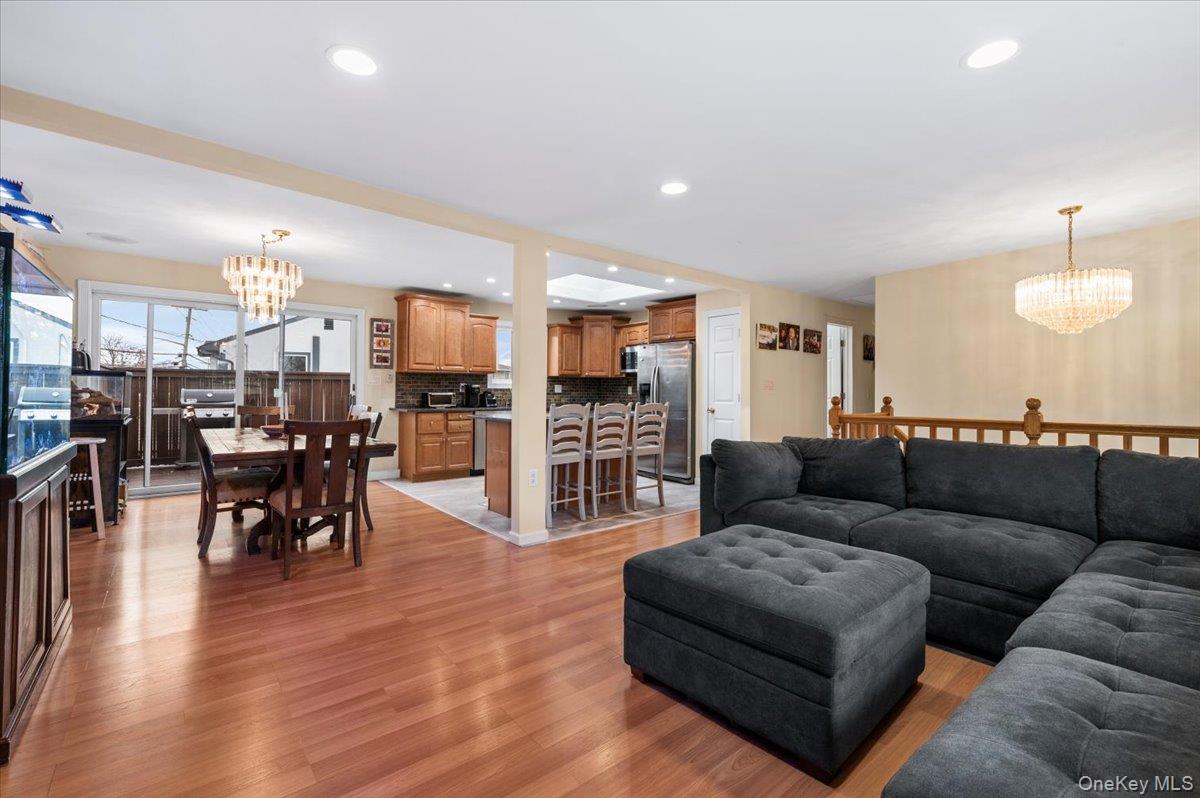 2747 Barbara Road Bellmore, NY 11710 - Photo 6 of 30 Living Room Corner Looking Into The Dinning Room & Kitchen Area. Sliders Off DR Out To The Deck.