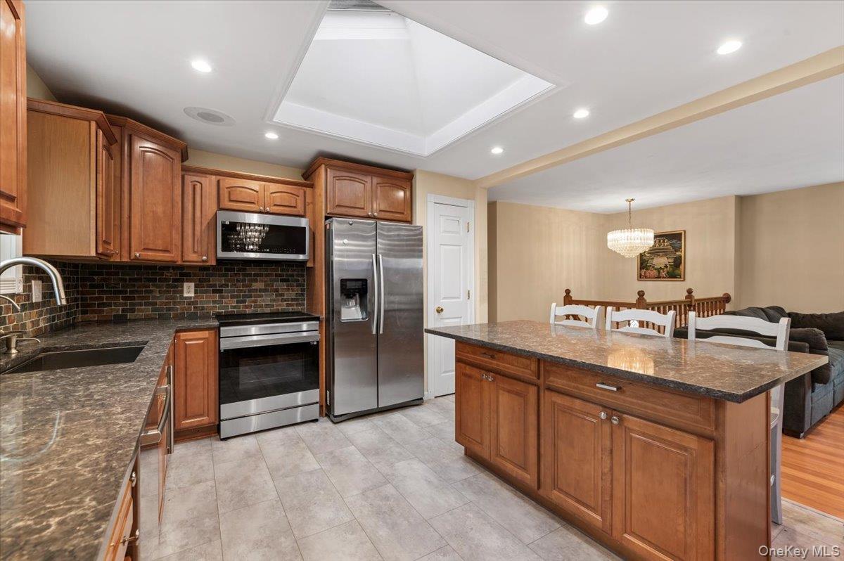 2747 Barbara Road Bellmore, NY 11710 - Photo 8 of 30 Updated Kitchen w/ Center Island and S/S Appliances.