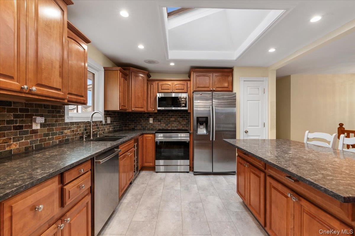 2747 Barbara Road Bellmore, NY 11710 - Photo 10 of 30 Updated Kitchen w/ Center Island and S/S Appliances.