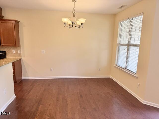 8227 Primanti Boulevard Raleigh, NC 27612 - Photo 7 of 25 wooden floor in an empty room with a window