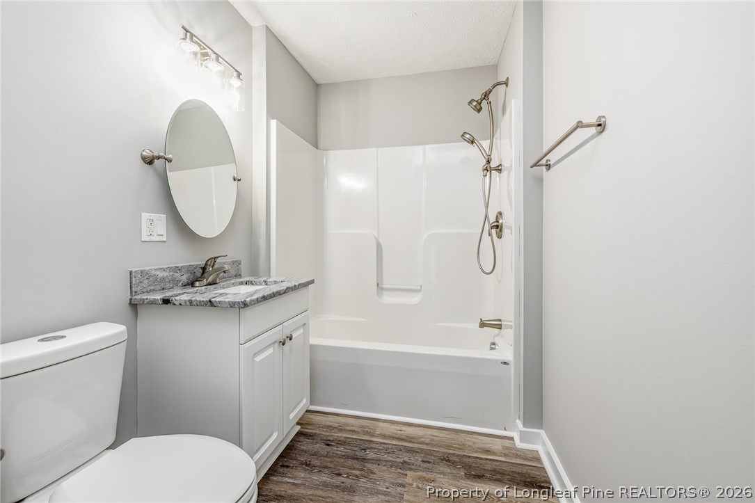 3524 Pine Log Road Lumberton, NC 28360 - Photo 22 of 42 a bathroom with a granite countertop toilet sink and shower