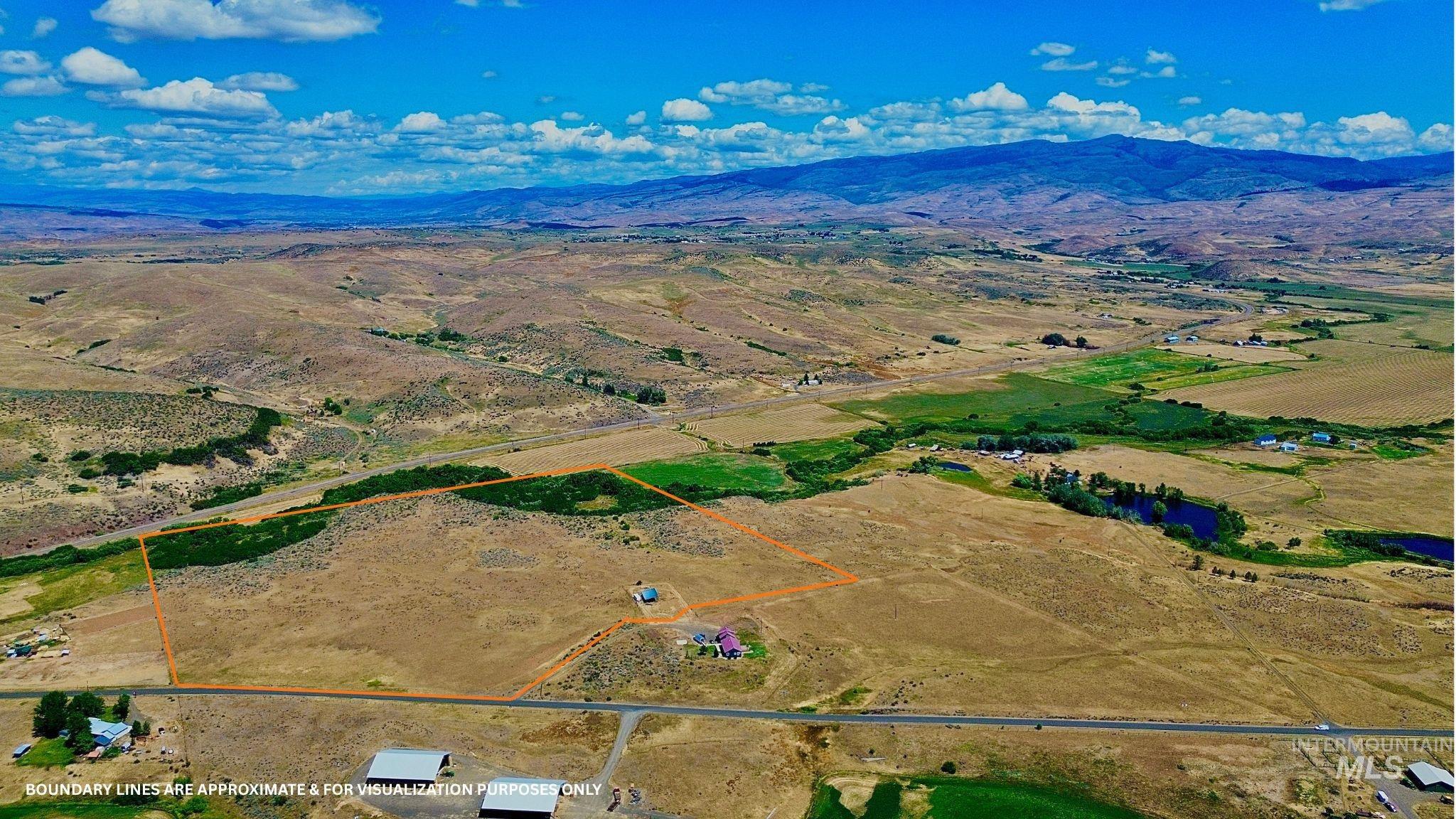 Nka West Indian Valley Road Indian Valley, ID 83632 - Photo 3 of 14 Aerial view of sparsely populated area featuring property parcel outlined and mountains
