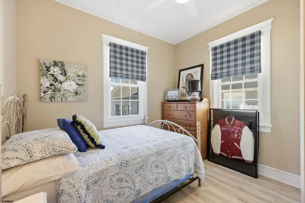 a bedroom with a bed and a fireplace