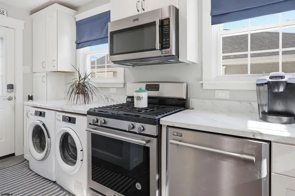 a kitchen with a stove and a refrigerator