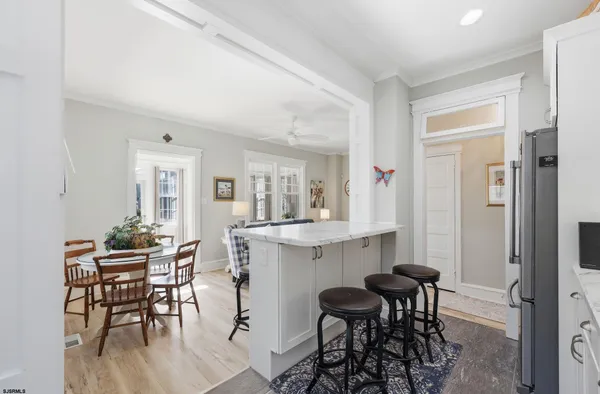 a kitchen with a refrigerator sink and cabinets