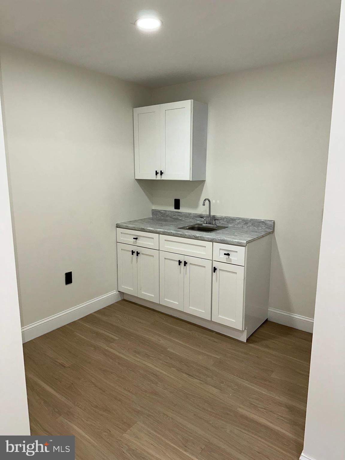 2000 Palethorp Street Philadelphia, PA 19122 - Photo 10 of 38 a kitchen with a sink a cabinets and window