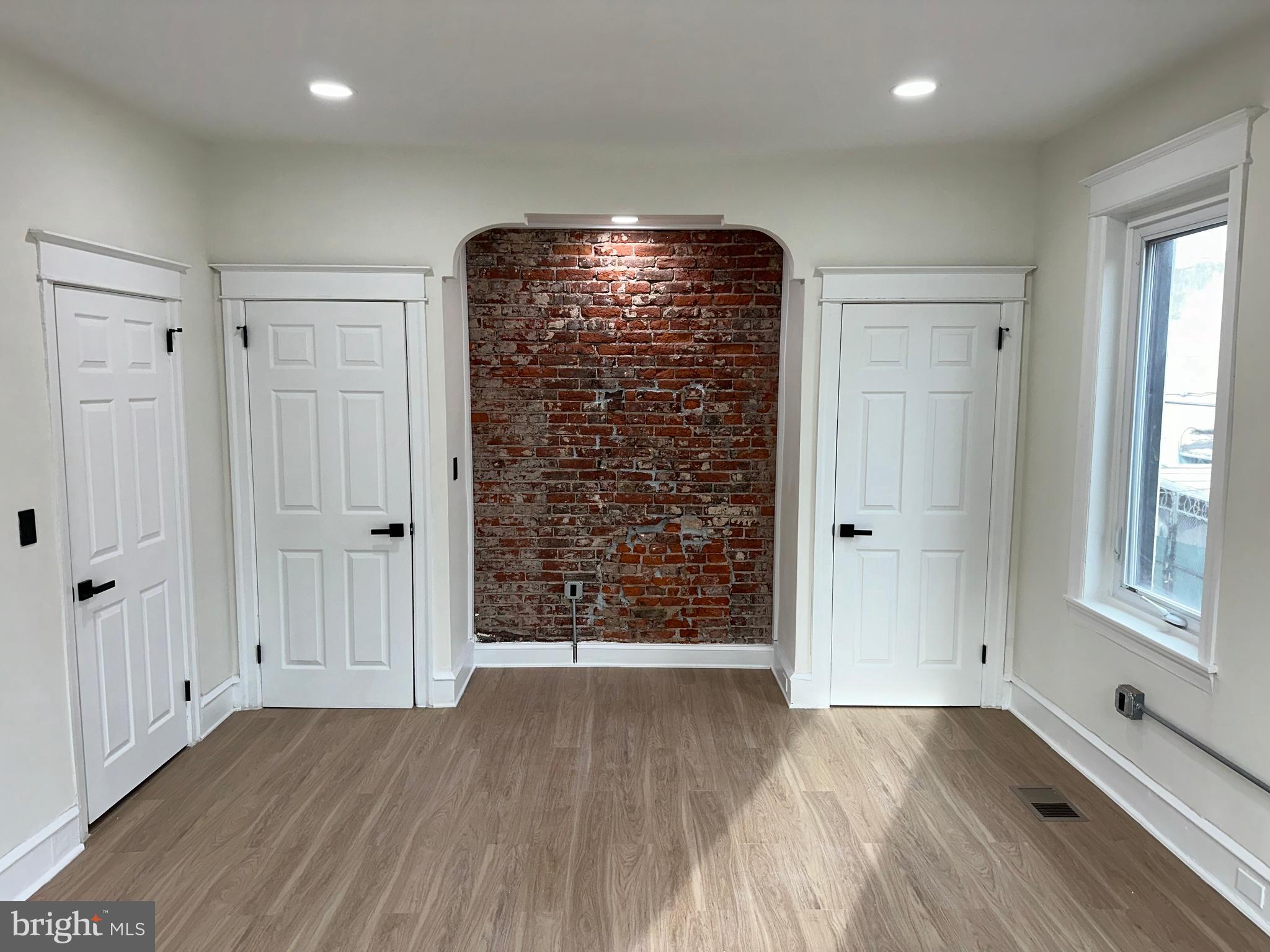 2000 Palethorp Street Philadelphia, PA 19122 - Photo 12 of 38 an empty room with wooden floor and windows