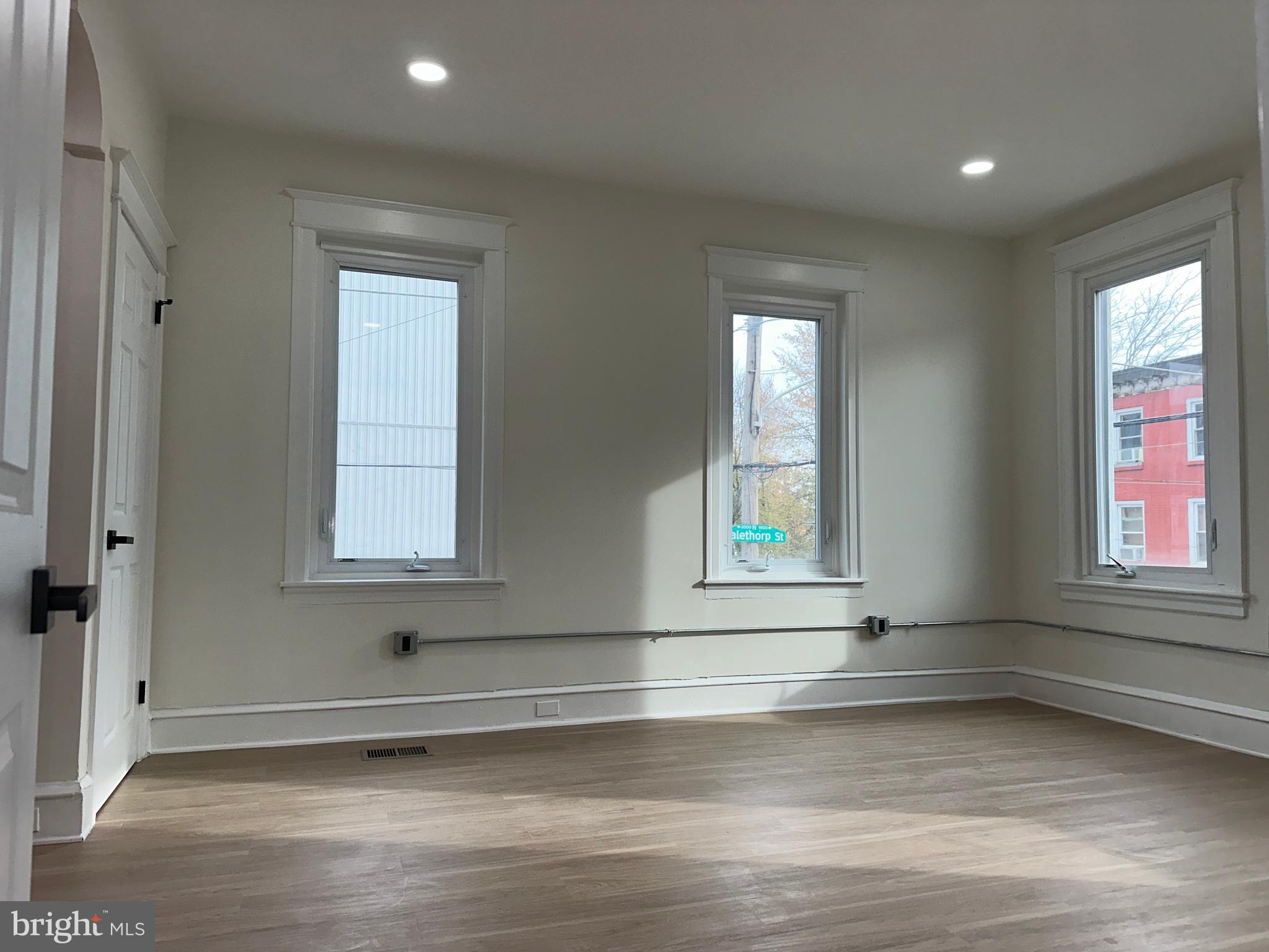 2000 Palethorp Street Philadelphia, PA 19122 - Photo 13 of 38 an empty room with wooden floor and windows