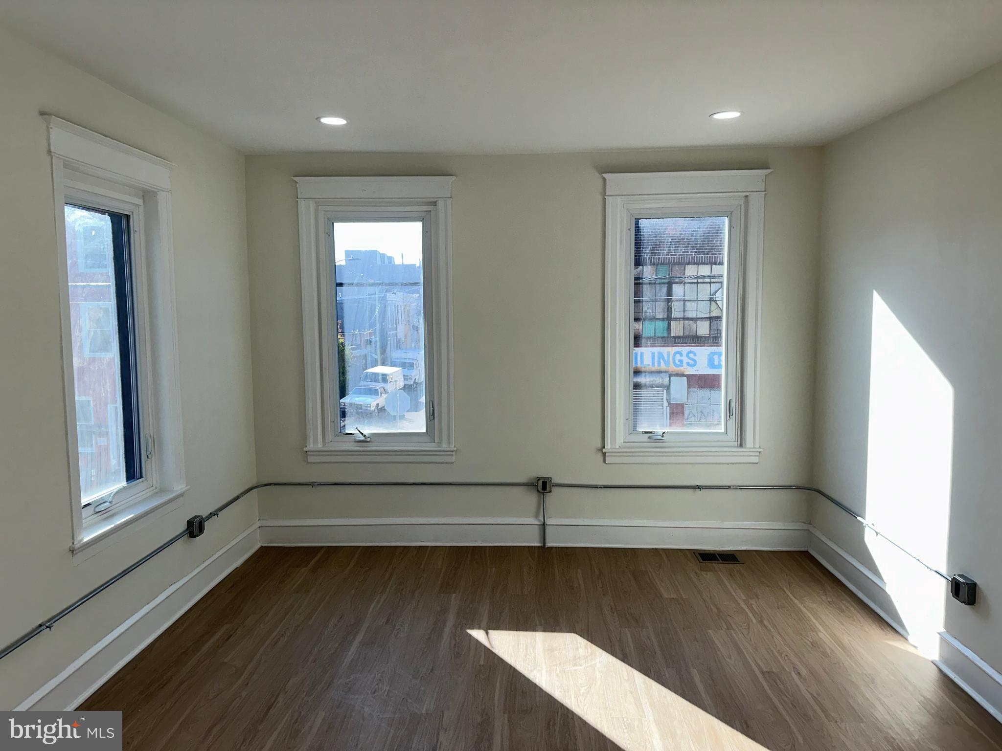 2000 Palethorp Street Philadelphia, PA 19122 - Photo 14 of 38 an empty room with wooden floor and windows