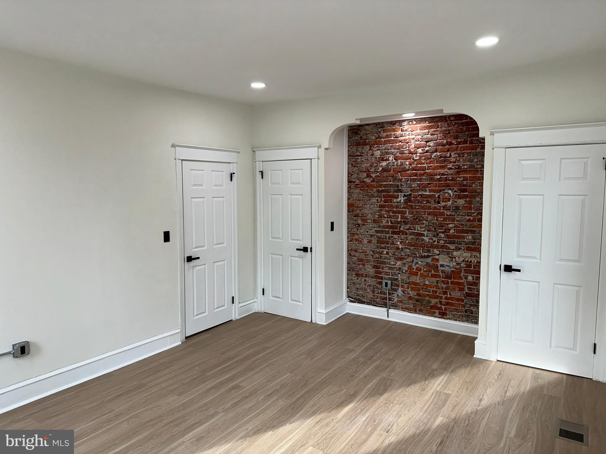 2000 Palethorp Street Philadelphia, PA 19122 - Photo 15 of 38 a view of an empty room with wooden floor and a window