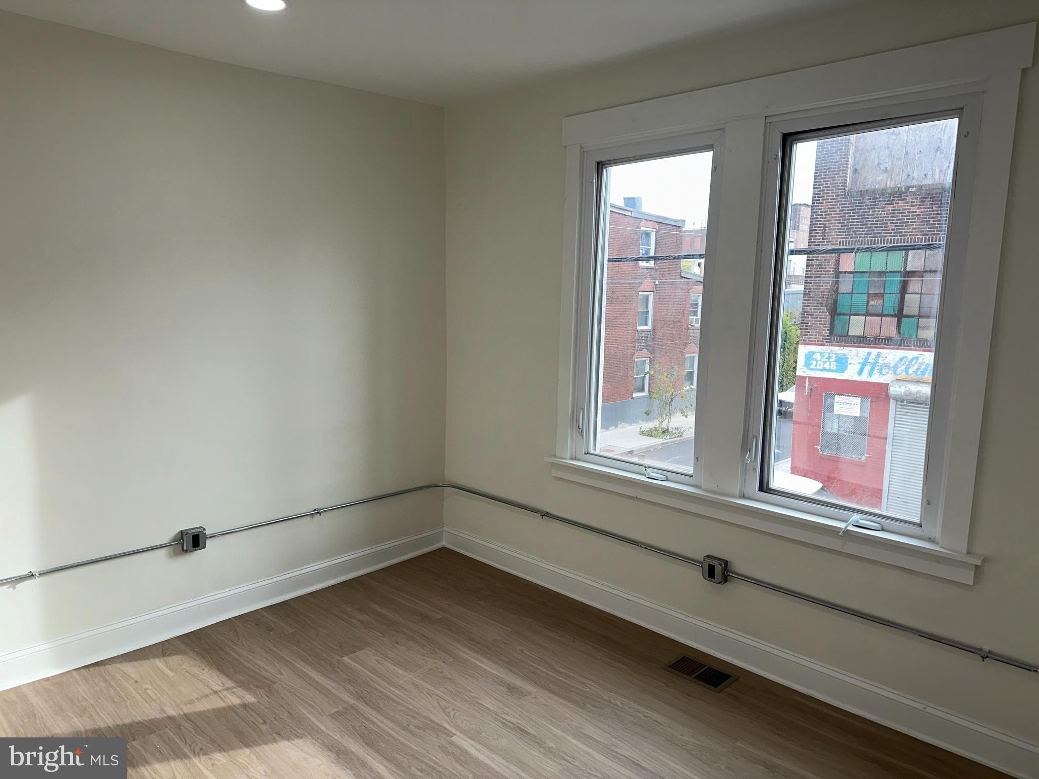 2000 Palethorp Street Philadelphia, PA 19122 - Photo 18 of 38 an empty room with wooden floor and windows