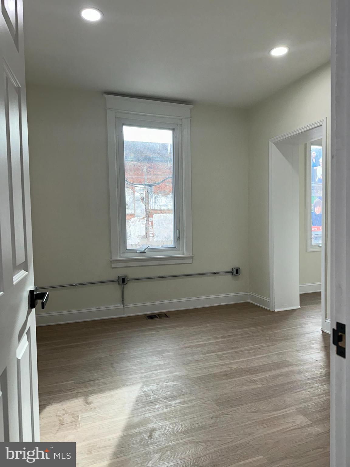 2000 Palethorp Street Philadelphia, PA 19122 - Photo 22 of 38 an empty room with wooden floor and windows