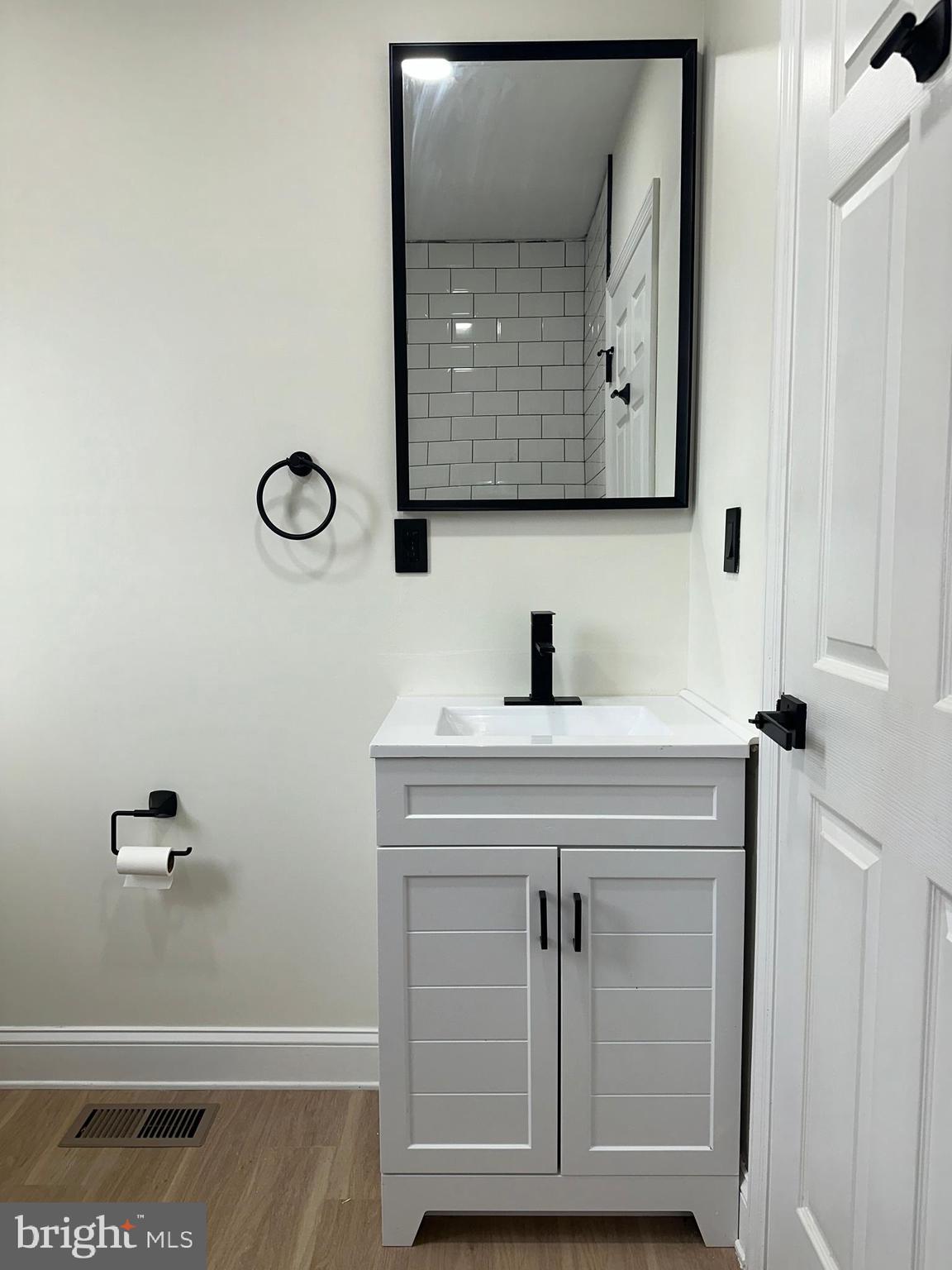 2000 Palethorp Street Philadelphia, PA 19122 - Photo 29 of 38 a bathroom with a sink and a mirror