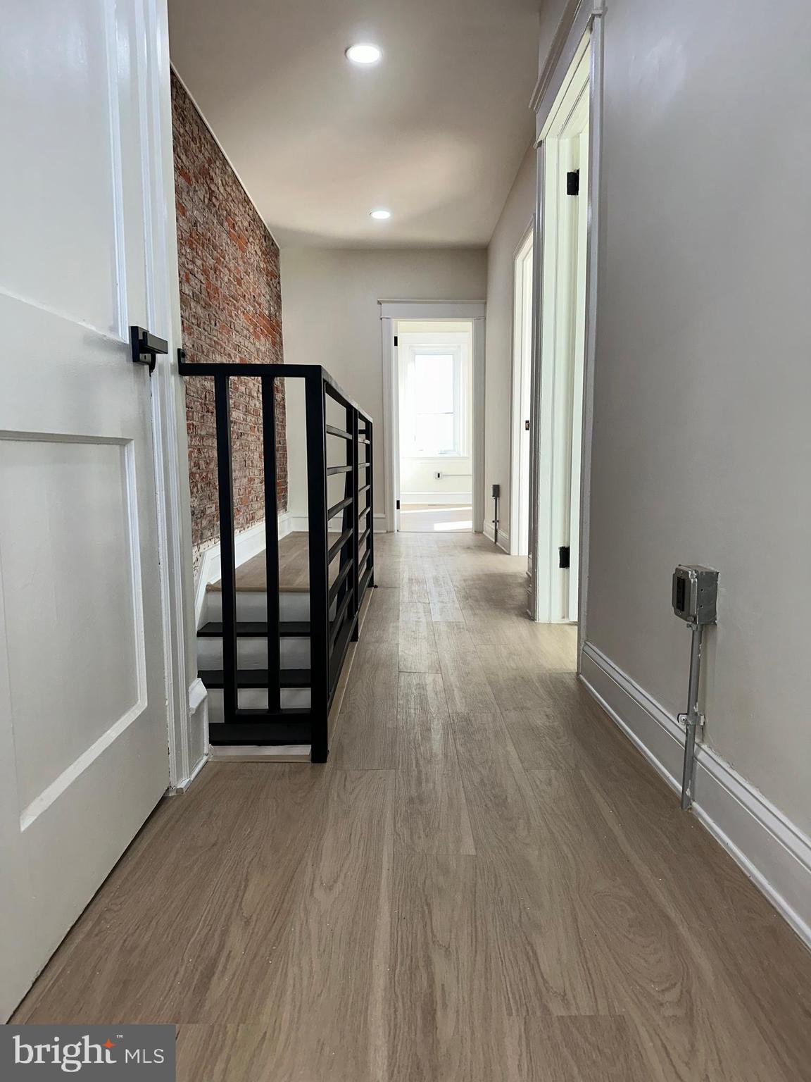 2000 Palethorp Street Philadelphia, PA 19122 - Photo 32 of 38 a view of a hallway with wooden floor and stairs